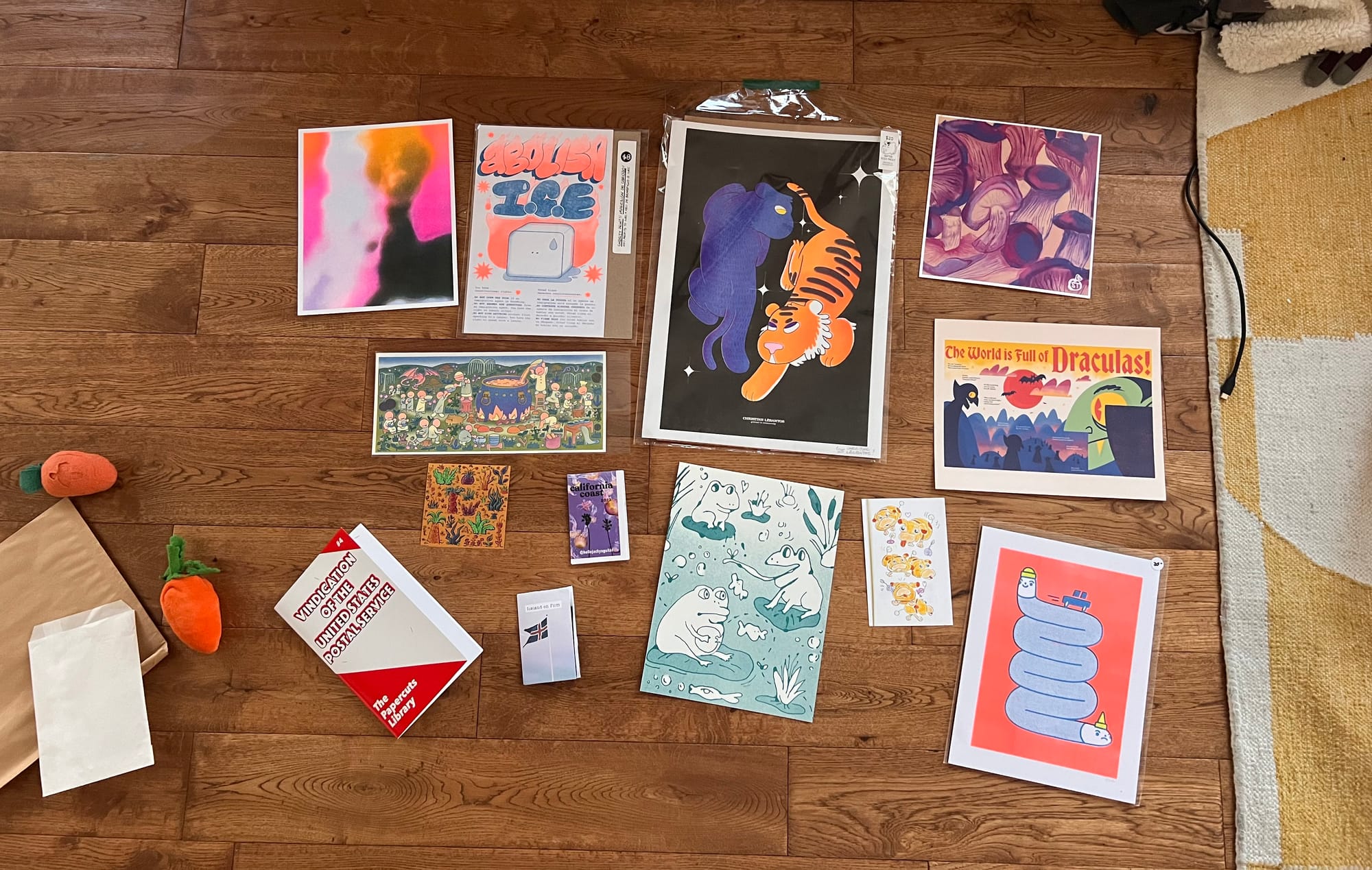 niki's zine haul including a few prints, a postcard, and three zines. 